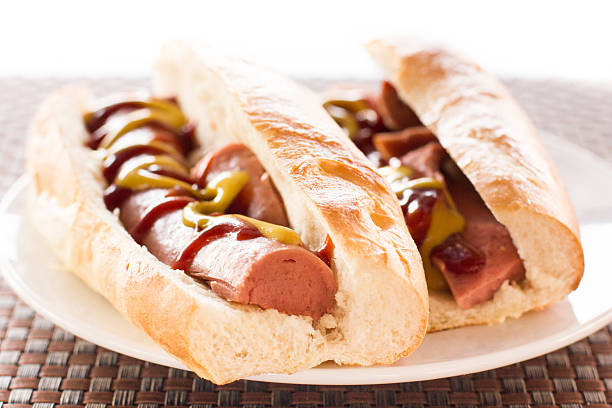 istock Two Hot Dogs With Ketchup and Mustard 472840094