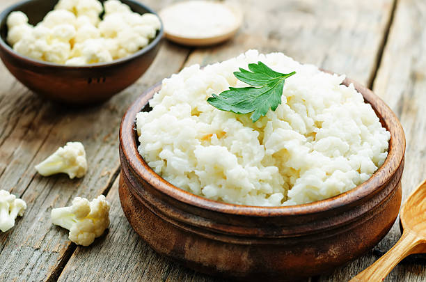 creamy cauliflower garlic rice stock photo