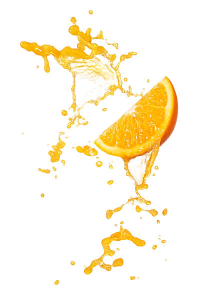 orange splash orange juice splashing with orange slice isolated on white orange juice stock pictures, royalty-free photos & images