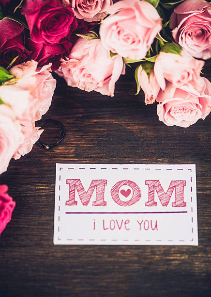 istock Mother's Day background with pink roses and greeting card message 472845160