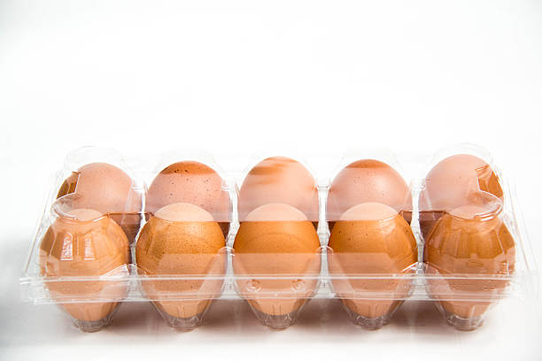 istock carton of fresh free range eggs on a white background. 472845730