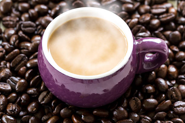 istock Coffee in cup on roasted coffee bean background 472850526