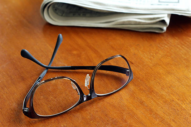 istock Glasses and newspapers 472850594