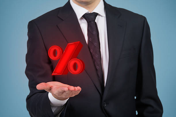 istock businessman holding red percentage 472853886