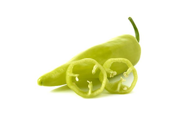 green chili peppers with stem on white background