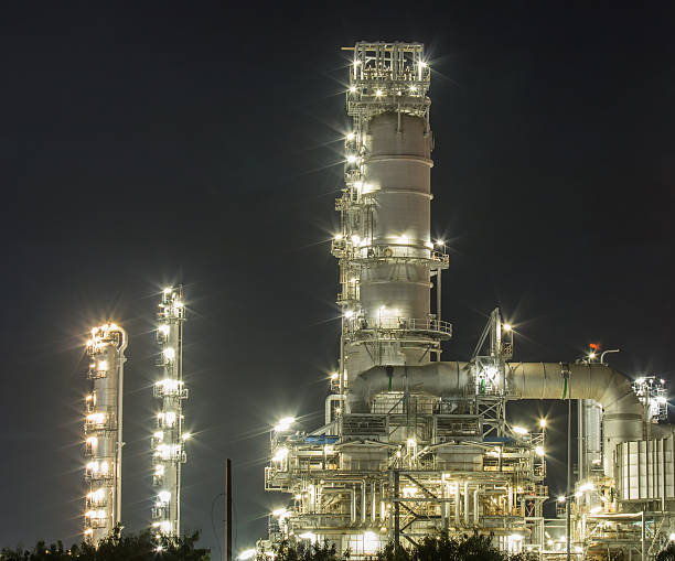 istock Oil refinery at night 472860172