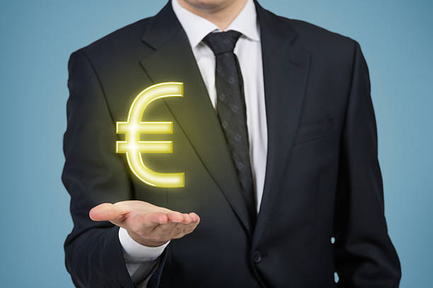 istock businessman holding euro 472861328