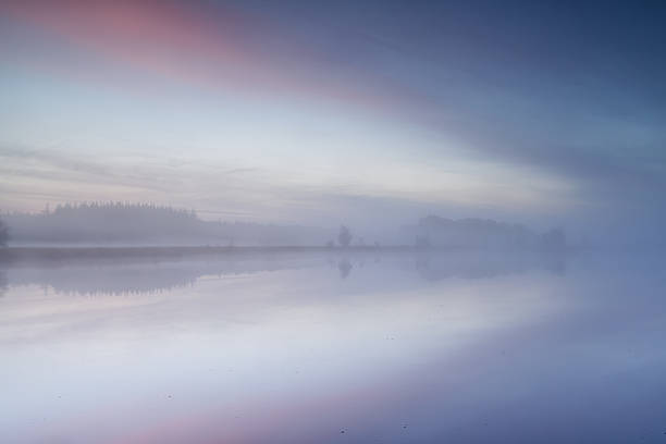 istock wild lake at misty sunrise 472861368