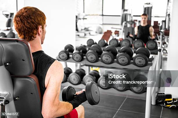 Red Head Man Training With Dumbell On Gym Stock Photo - Download Image Now - 20-29 Years, 2015, Activity