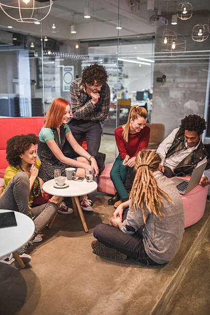 istock Happy start-up team using laptop together on a break. 472863918