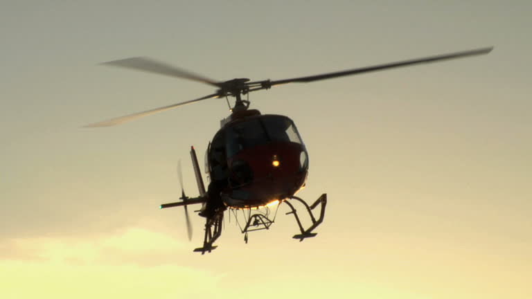 Helicopter Flying at Sunset