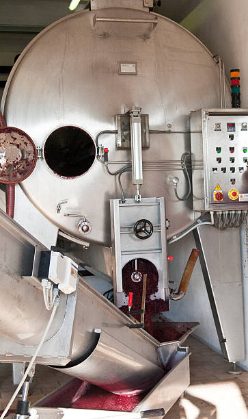 istock modern machine for the production of wine 472866020