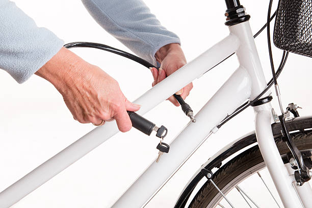 istock Securing the bike with a chain with a key 472866206