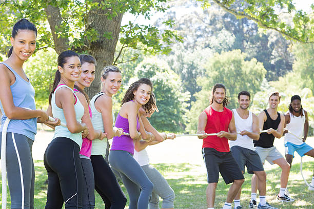 istock Fitness group playing tug of war 472869220