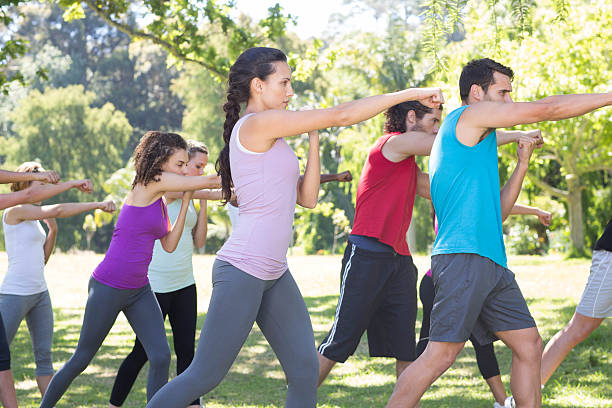istock Fitness group working out in park 472869534