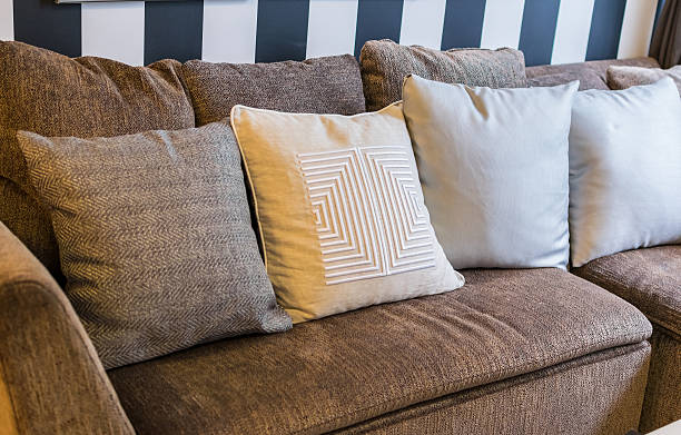 istock row of pillows on sofa in living room 472881320