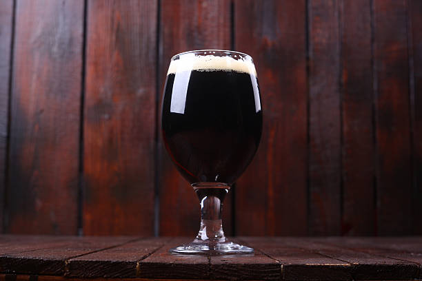 istock Dark beer on wood 472881398