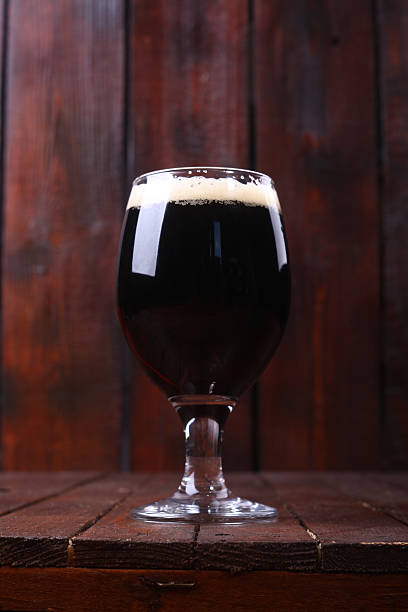 istock Dark beer on wood 472881400