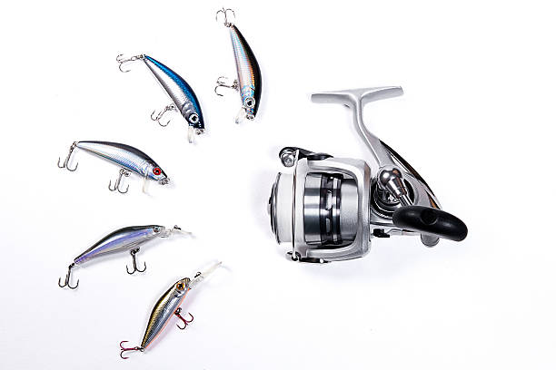 istock Fishing reel with plastic fishing baits. 472884598