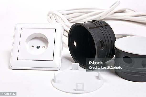 Electric Sockets And Power Cable On White Surface Stock Photo - Download Image Now - 2015, Appliance, Boarding