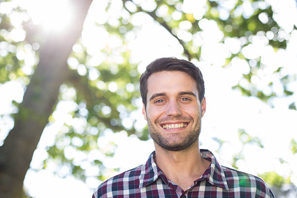 istock Happy young man in the park 472894088