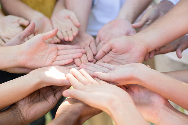 istock Friends putting their hands together 472894206