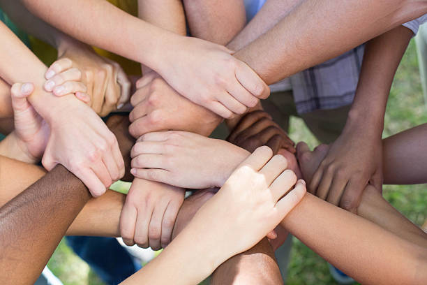 istock Friends putting their hands together 472894282