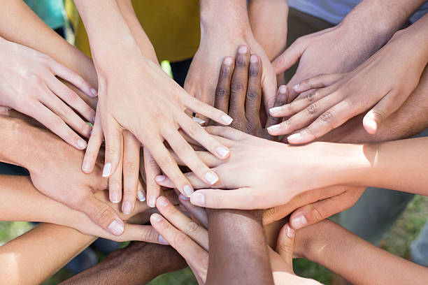 istock Friends putting their hands together 472894284