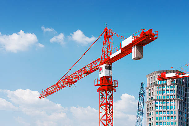 Inside place for tall buildings under construction and cranes.