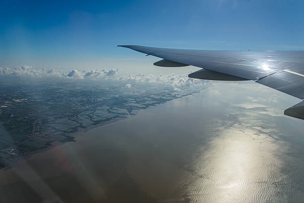 istock Space view from airliner window with blue sky and clouds. 472896752