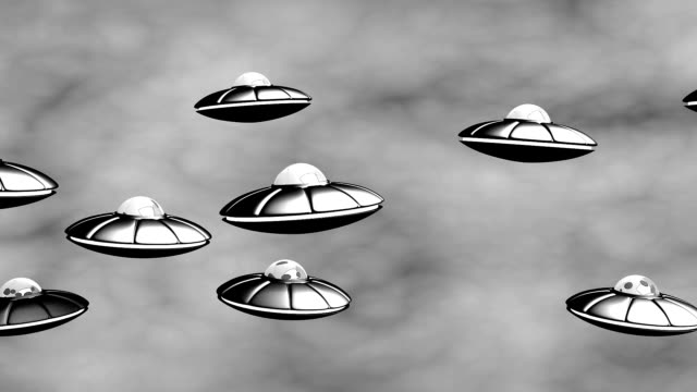 UFO flying in the sky. Loop, alpha.