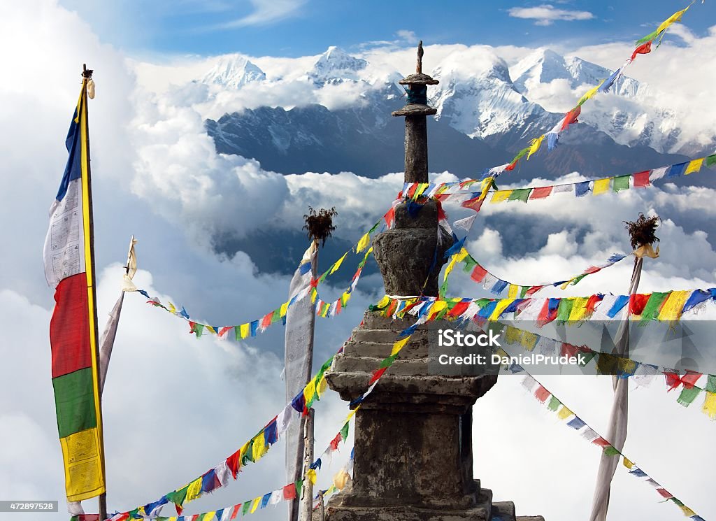 Ganesh Himal with stupa and prayer flags view from Langtang to Ganesh Himal with stupa and prayer flags and beautiful clouds - Nepal 2015 Stock Photo