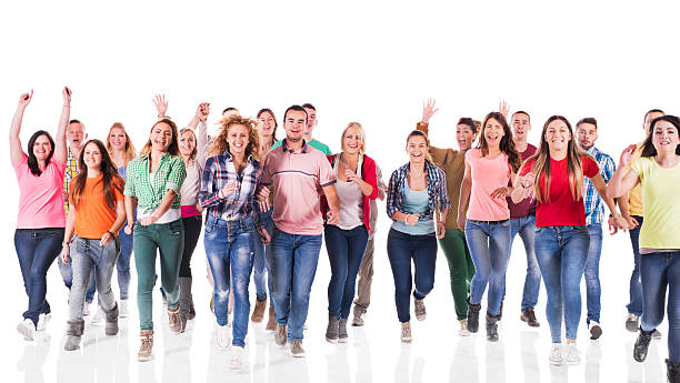 istock Large group of young cheerful people running. Isolated on white. 472899618