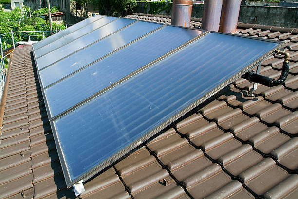 istock House with solar panels on roof 472903154