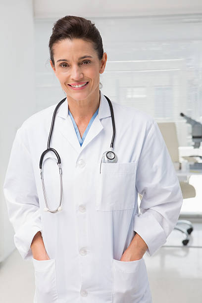 istock Smiling veterinarian standing with stethoscope 472903452