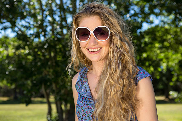 istock Pretty blonde smiling at camera 472910860