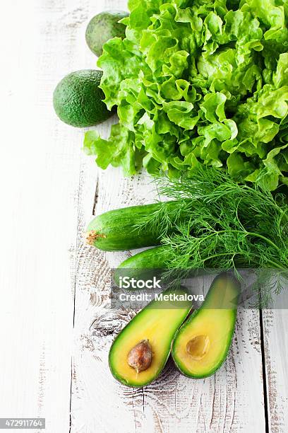 A Mixture Of Green Vegetables On A Wooden Table Stock Photo - Download Image Now - 2015, Appetizer, Arugula