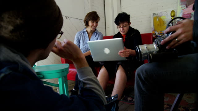 Group of art students with laptop computer