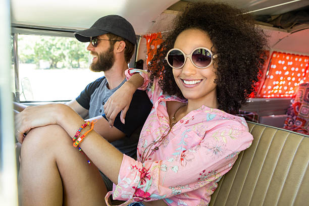 istock Hipster couple driving in camper van 472914802