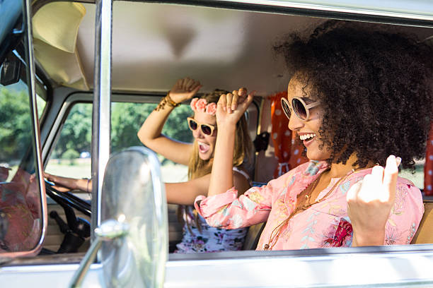 Happy friends on a road trip Happy friends on a road trip on a summers day hipster car stock pictures, royalty-free photos & images