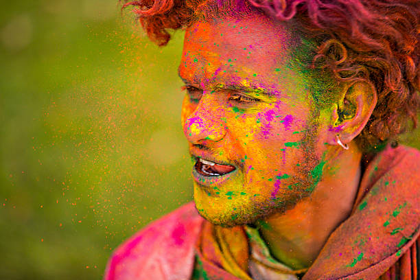 istock Happy Holi in orange and yellow 472915190