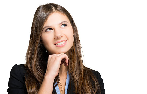 istock Beautiful young woman in a pensive expression 472916080