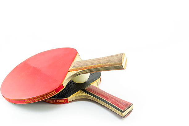 istock Two table tennis rackets and a ball isolated 472921072