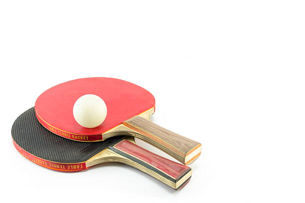 istock Two table tennis rackets and a ball isolated 472921076