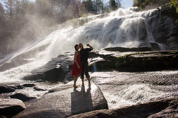istock Woman and man on rock 472923344