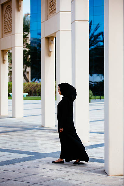 istock Emirati woman full-leught portrait 472924860