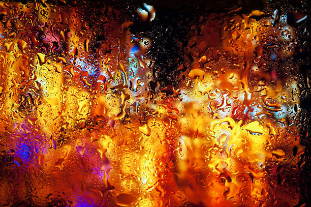 istock Night city through a wet window 472927876