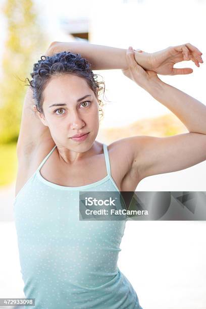 Attractive Young Woman Stretching Before Exercise Stock Photo - Download Image Now - 2015, Active Lifestyle, Adult