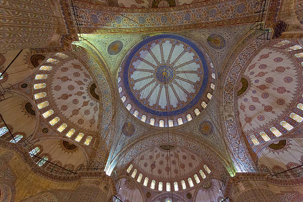 Painted ceiling with illumination in the Blue mosque in Istanbul stock photo