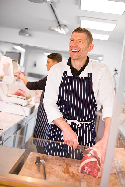 istock happy butcher's shop 472933974